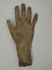 Hand: Cast in latex from a plaster mould and painted into to look decayed