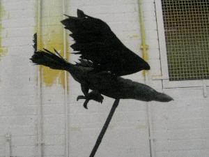 Raven puppet: Made with various materials. The raven is raised on a detachable banboo stick and when animated the wings move. Designed by Steve Denton for Noyes Fludd
