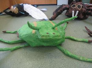 Workshop Leader making Giant Insect Sculptures with Primary Schools in Caerphilly
